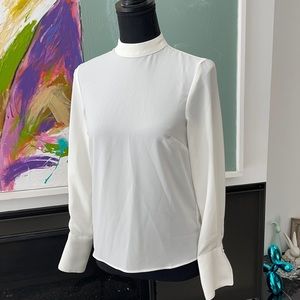 Blouse with open back detail and high collar